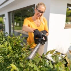 AL-KO HT 1845 18V Bosch Home & Garden Compatible Cordless Hedge Trimmer (Tool Only) -Greenworks Sale Shop al ko ht1845 hedge trimmer lifestyle in use