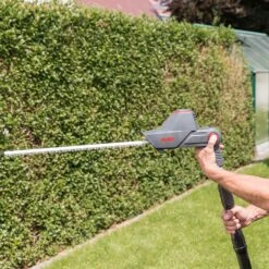 AL-KO HTA 1845 18V Bosch Home & Garden Compatible Cordless Long Reach Hedge Trimmer (with 2.5Ah Battery & Charger) -Greenworks Sale Shop al ko hta1845 pole hedge trimmer lifestyle 4 1