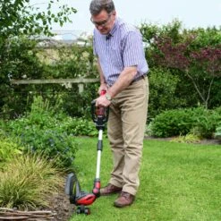 Cobra GT3024V Li-Ion Cordless Grass Trimmer (with 2Ah Battery & Charger) -Greenworks Sale Shop cobra gt3024v grass trimmer lifestyle