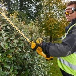 DeWalt DCM563PB-XJ 18V XR Cordless Hedge Trimmer (Tool Only) -Greenworks Sale Shop dewalt dcm563 hedge trimmer lifestyle 2