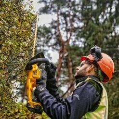 DeWalt DCMHT563P1-GB 18V XR Cordless Hedge Trimmer (with 5Ah Battery & Charger) -Greenworks Sale Shop dewalt dcmht563 hedge trimmer lifestyle 2