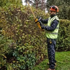 DeWalt DCMHT563P1-GB 18V XR Cordless Hedge Trimmer (with 5Ah Battery & Charger) -Greenworks Sale Shop dewalt dcmht563 hedge trimmer lifestyle 4