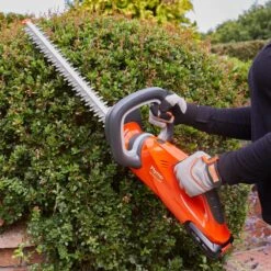 Flymo EasiCut 450 18V Cordless Hedge Trimmer (with 2.0Ah Battery & Charger) -Greenworks Sale Shop flymo easicut 450 hedge trimmer lifestyle