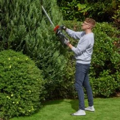Flymo UltraCut 500 18V Cordless Hedge Trimmer (with 2.5Ah Battery & Charger) 19 Flymo UltraCut 500 18V Cordless Hedge Trimmer (with 2.5Ah Battery & Charger) -Greenworks Sale Shop flymo ultracut500 hedge trimmer lifestyle conifer