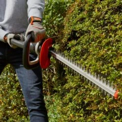 Flymo UltraCut 500 18V Cordless Hedge Trimmer (with 2.5Ah Battery & Charger) (Bundle Builder) 18 Flymo UltraCut 500 18V Cordless Hedge Trimmer (with 2.5Ah Battery & Charger) (Bundle Builder) -Greenworks Sale Shop flymo ultracut500 hedge trimmer lifestyle in use 1