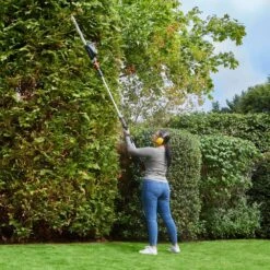 Flymo UltraReach 420 18V Cordless Pole Hedge Trimmer (with 2.5Ah Battery & Charger) (Bundle Builder) -Greenworks Sale Shop flymo ultrareach 420 pole hedge trimmer lifestyle 1