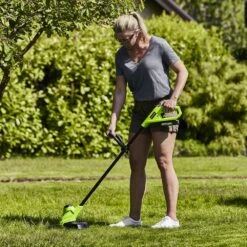 GreenWorks G24LT25K2 25cm 24V Cordless Grass Trimmer (with 2Ah Battery & 0.5A Economy Charger) -Greenworks Sale Shop gwg24lt25 in use 2 1