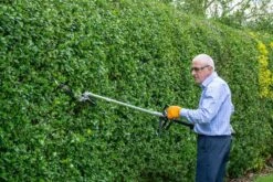 The Handy MT26 4-in-1 Garden Multi Tool -Greenworks Sale Shop the handy multi tool pole hedge trimmer lifestyle